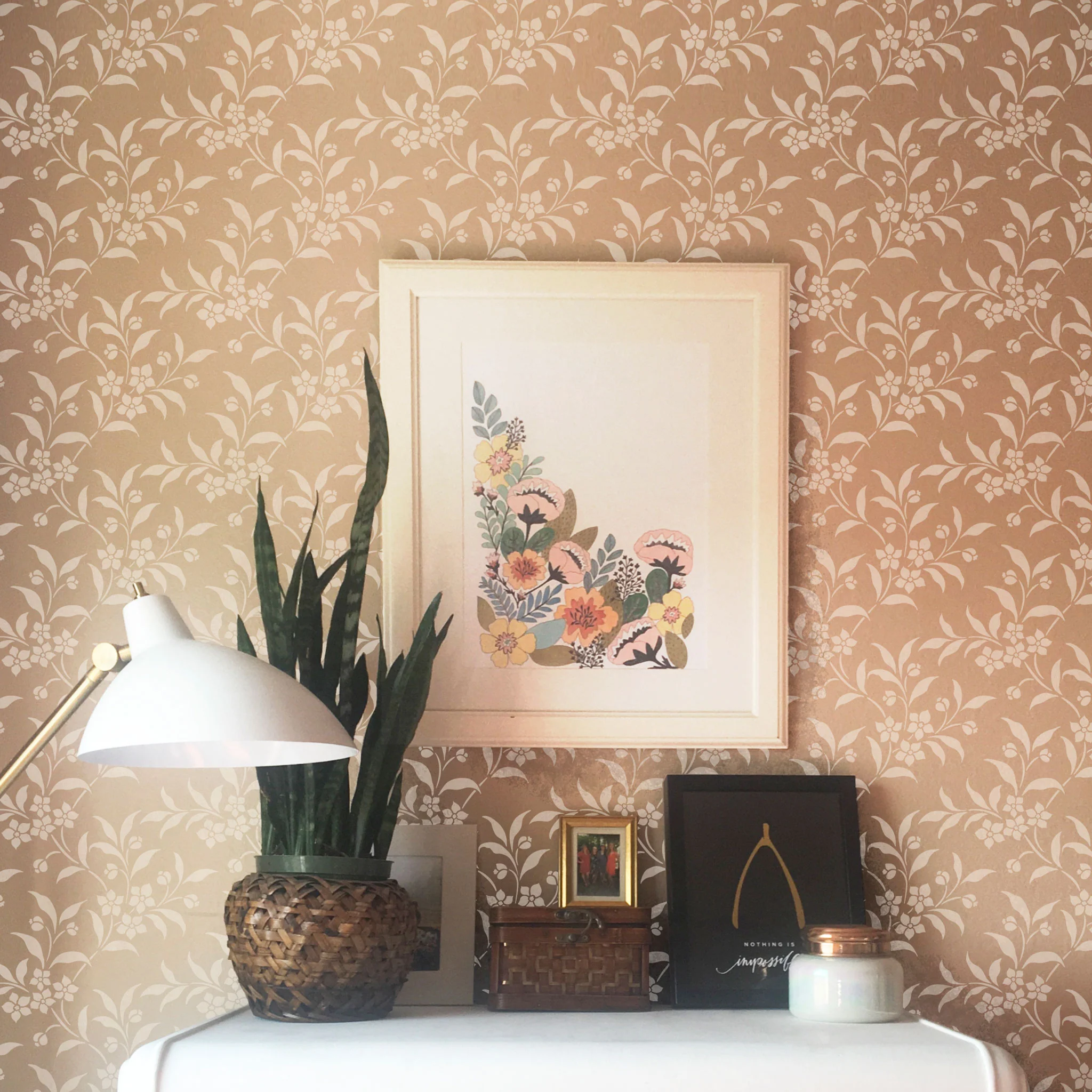 Wall stencil in floral vine pattern stenciled on a bedroom wall